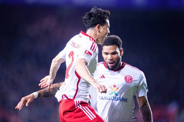 15.03.2024 - Fußball, 2023 2024, 2. Bundesliga, 26. Spieltag, VfL Osnabrück - Fortuna Düsseldorf: (L-R) Takashi Uchino (Düsseldorf) jubelt nach seinem Tor zum 0:2 mit Jamil Siebert (Düsseldorf) DFL REGULATIONS PROHIBIT ANY USE OF PHOTOGRAPHS AS IMAGE SEQUENCES AND OR QUASI-VIDEO.