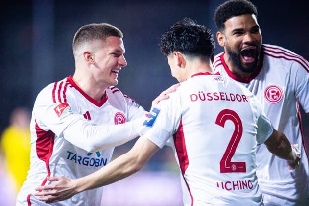15.03.2024 - Fußball, 2023 2024, 2. Bundesliga, 26. Spieltag, VfL Osnabrück - Fortuna Düsseldorf: (M-R) Takashi Uchino (Düsseldorf) jubelt nach seinem Tor zum 0:2 mit (R) Jamil Siebert (Düsseldorf), (L) Christos Tzolis (Düsseldorf) DFL REGULATIONS PROHIBIT ANY USE OF PHOTOGRAPHS AS IMAGE SEQUENCES AND OR QUASI-VIDEO.