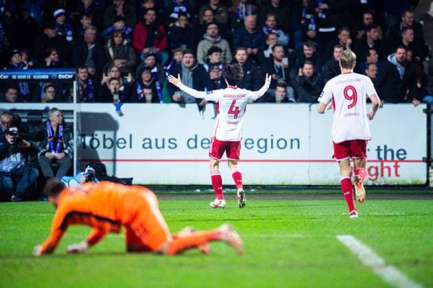 15.03.2024 - Fußball, 2023 2024, 2. Bundesliga, 26. Spieltag, VfL Osnabrück - Fortuna Düsseldorf: (M) Ao Tanaka (Düsseldorf) jubelt nach seinem Tor zum 0:4 mit Vincent Vermeij (Düsseldorf), (L) Philipp Kühn (Osnabrück) DFL REGULATIONS PROHIBIT ANY USE OF PHOTOGRAPHS AS IMAGE SEQUENCES AND OR QUASI-VIDEO.