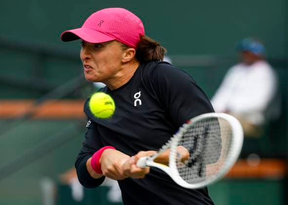 March 15, 2024 Iga Swiatek of Poland returns a shot against Marta Kostyuk of the Ukraine in their Semifinal match during the BNP Paribas Open in Indian Wells, CA. CSM Indian Wells United States of America - ZUMAc04_ 20240315_zma_c04_133 Copyright: xCharlesxBausx
