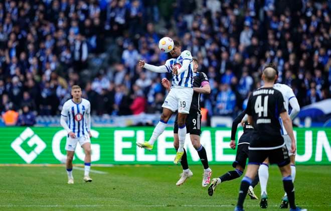 Germany, Berlin, 17.03.2024, Olympic Stadium, Hertha BSC vs FC Schalke 04 - 2. Bundesliga, Jeremy Dudziak (Hertha Berlin) and Simon Terodde (FC Schalke 04) battle for the ball Berlin Olympic Stadium Berlin Germany