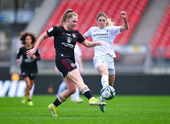 Germany, Nuernberg, 17.03.2024, Max-Morlock-Stadion, 1. FC Nuernberg vs SC Freiburg - Frauen-Bundesliga, Madeleine Steck (1. FC Nuernberg) und Eileen Campbell (SC Freiburg) battle for the ball Nuremberg Max-Morlock-Stadion Bavaria Germany