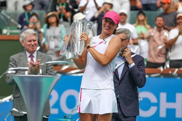 INDIAN WELLS, CA - MARCH 17: Iga Swiatek (POL) poses with the trophy after winning the womenÕs singles final during the BNP Paribas Open on March 17, 2024 at Indian Wells Tennis Garden in Indian Wells, CA. (Photo by George Walker Icon Sportswire) TENNIS: MAR 17 BNP Paribas Open EDITORIAL USE ONLY Icon240317003