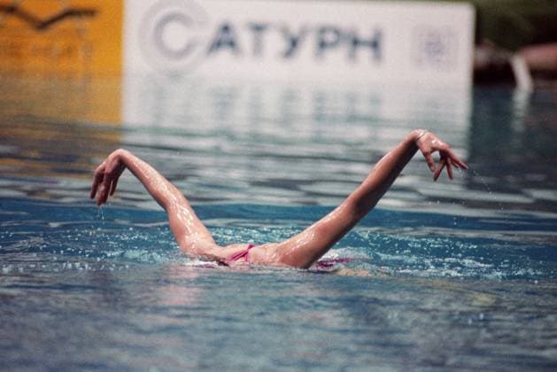 Moscow, USSR. An athlete performs a routine during the 9th International Synchronised Swimming Tournament for the prizes of the Soviet Woman magazine in the swimming pool of the Olympic Sports Complex. Igor Utkin TASS  18756270