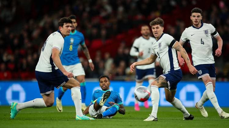 England v Brazil, London, UK - 23 Mar 2024 Rodrygo of Brazil has a shot past John Stones and Harry Maguire of England during the International Friendly, Länderspiel, Nationalmannschaft match between England and Brazil at Wembley Stadium, London on 23 March 2024 ( London Wembley Stadium London England Copyright: xMicahxCrook PPAUKx PPA-100881