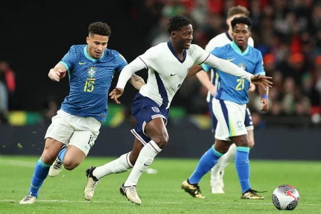 Kobbie Mainoo of England has his shirt pulled and gets away from Joao Gomes of Brazil England v Brazil, International Football Friendly, Wembley Stadium, Wembley, London, UK - 23 03 2024 Editorial use only  Copyright: xMattxImpey Shutterstockx 14399525y