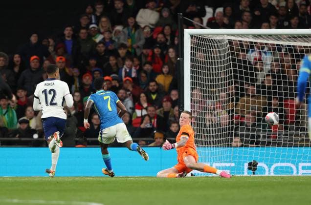 Vinicius Junior (B) scores past Jordan Pickford (E) for the first Brazil goal (0-1) at the England v Brazil international match, Länderspiel, Nationalmannschaft at Wembley Stadium, London, UK on 23rd March, 2024. 