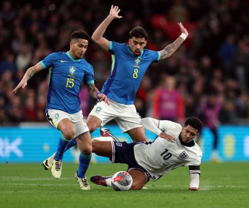 Jude Bellingham of England with Lucas Paqueta (8) & Joao Gomes (15) of Brazil England v Brazil - International Friendly, Länderspiel, Nationalmannschaft Football, Wembley Stadium. UK. 23 MAR 2024 Editorial use only  Copyright: xJASONPIX Shutterstockx 14399594ab