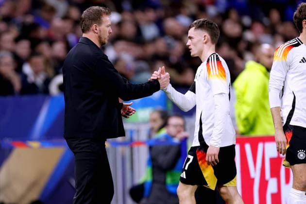 NAGELSMANN Julian Trainer Team Deutschland mit WIRTZ Florian bei der Auswechslung Laenderspiel Frankreich - Deutschland 0 : 2 am 23. 03. 2024 in Lyon DFL REGULATIONS PROHIBIT ANY USE OF PHOTOGRAPHS as IMAGE SEQUENCES and or QUASI-VIDEO Copyright: xLacixPerenyix