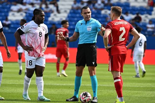 RECORD DATE NOT STATED CONCACAF NATIONS LEAGUE 2023-2024 Canada vs Trinidad and Tobago - Play In Daniel Phillips (L) of Trinidad, Referee Marco Antonio Ortiz (C) of Mexico and Alistair Johnston (R) of Canada during the Play In match between Canada and Trinidad and Tobago as part of the 2024 Concacaf Nations League, for the pass to the Copa America in the United States 2024, at Toyota Stadium, Frisco, Texas, on March 23, 2024. FRISCO TEXAS UNITED STATES  Copyright: xDavidxLeahx 20240323145034_CNL_24_PLAY_IN_CAN_TRI_ORTIZ104