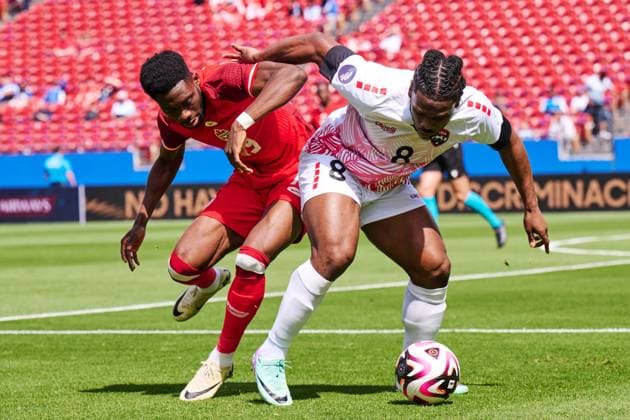 RECORD DATE NOT STATED CONCACAF NATIONS LEAGUE 2023-2024 Canada vs Trinidad and Tobago - Play In Alphonso Davies (L) of Canada fights for the ball with Daniel Phillips (R) of Trinidad during the Play In match between Canada and Trinidad and Tobago as part of the 2024 Concacaf Nations League, for the pass to the Copa America in the United States 2024, at Toyota Stadium, Frisco, Texas, on March 23, 2024. FRISCO TEXAS UNITED STATES  Copyright: xJorgexMartinezx 20240323150638_CNL_24_PLAY_IN_CAN_TRI_PHILLIPS108