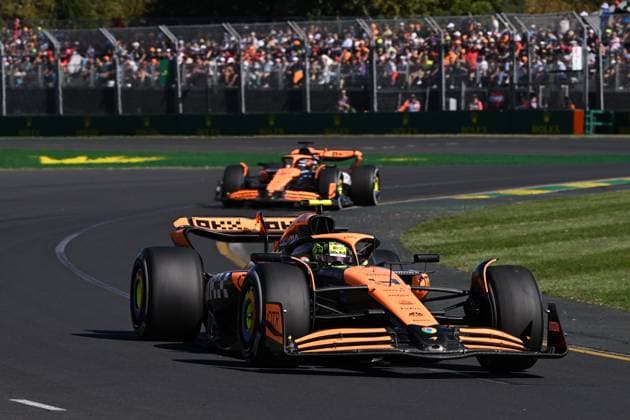 AUSTRALIAN F1 GRAND PRIX, Lando Norris of McLaren leads Oscar Piastri during the Australian Grand Prix 2024 at Albert Park Circuit in Melbourne, Sunday, March 24, 2024. ( NO ARCHIVING, EDITORIAL USE ONLY, NO USE IN BOOKS WITHOUT CONSENT MELBOURNE VICTORIA AUSTRALIA  Copyright: xJOELxCARRETTx 20240324001921940483