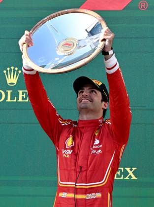 AUSTRALIAN F1 GRAND PRIX, Race winner Ferrari driver Carlos Sainz, of Spain celebrates on podium following the Australian Grand Prix 2024 at Albert Park Circuit in Melbourne, Sunday, March 24, 2024. ( NO ARCHIVING, EDITORIAL USE ONLY, NO USE IN BOOKS WITHOUT CONSENT MELBOURNE VICTORIA AUSTRALIA  Copyright: xJOELxCARRETTx 20240324001921966798