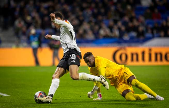 Lyon, France. 23rd Mar 2024. Jamal Musiala (Deutschland) Torwart Brice Samba (FRA) Frankreich - Deutschland France - Germany 23.03.2024