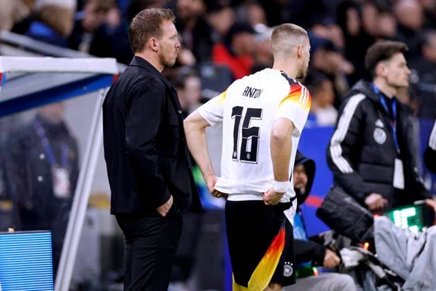 NAGELSMANN Julian Trainer Team Deutschland mit ANTON Waldemar bei der Einwechslung Laenderspiel Frankreich - Deutschland 0 : 2 am 23. 03. 2024 in Lyon DFL REGULATIONS PROHIBIT ANY USE OF PHOTOGRAPHS as IMAGE SEQUENCES and or QUASI-VIDEO Copyright: xLacixPerenyix