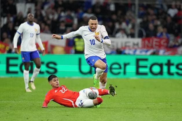 Kylian Mbappe of France is fouled by Dario Osorio of Chile France v Chile, International Friendly, Länderspiel, Nationalmannschaft Football, Stade Velodrome, Marseille, France - 26 Mar 2024 EDITORIAL USE ONLY No use with unauthorised audio, video, data, fixture lists, club league logos or live services. Online in-match use limited to 120 images, no video emulation. No use in betting, games or single club league player publications.  Copyright: xDavexWinter Shutterstockx 14400428ap