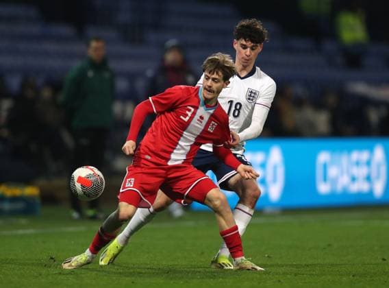 26th March 2024; Toughsheet Community Stadium, Bolton, Greater Manchester, England; UEFA U21, U 21 EURO Qualifier, EM, Europameisterschaft England U21 versus Luxembourg U21; Fabio Lohei of Luxembourg hold off a challenge from James McAtee of England  ActionPlus12622257 DavidxBlunsden