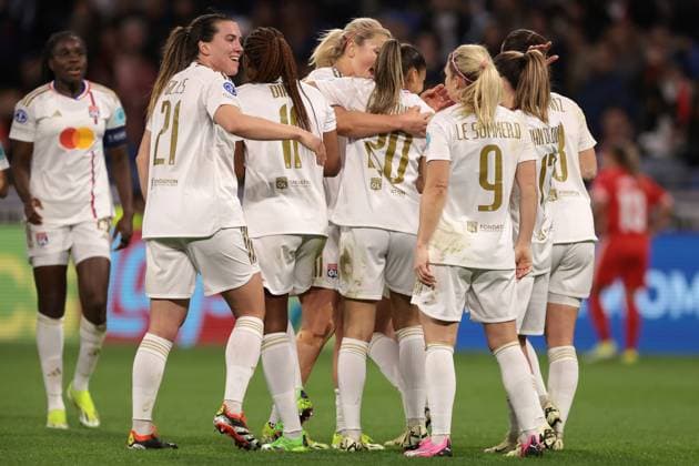 Lyon, France, 27th March 2024. Delphine Cascarino of Lyon celebrates with team mates after scoring to give the side a 1-0 lead during the UEFA Womens Champions League match at OL Stadium, Lyon. Picture credit should read: Jonathan Moscrop Sportimage EDITORIAL USE ONLY. No use with unauthorised audio, video, data, fixture lists, club league logos or live services. Online in-match use limited to 120 images, no video emulation. No use in betting, games or single club league player publications. SPI-3032-0005