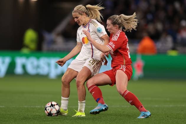 Lyon, France, 27th March 2024. Chandra Davidson of SL Benfica challenges Lindsey Horan of Lyon during the UEFA Womens Champions League match at OL Stadium, Lyon. Picture credit should read: Jonathan Moscrop Sportimage EDITORIAL USE ONLY. No use with unauthorised audio, video, data, fixture lists, club league logos or live services. Online in-match use limited to 120 images, no video emulation. No use in betting, games or single club league player publications. SPI-3032-0015