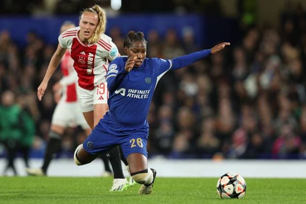 London, England, 27th March 2024. Kadeisha Buchanan of Chelsea is challenged by Tiny Hoekstra of Ajax during the UEFA Womens Champions League match at Stamford Bridge, London. Picture credit should read: Paul Terry Sportimage EDITORIAL USE ONLY. No use with unauthorised audio, video, data, fixture lists, club league logos or live services. Online in-match use limited to 120 images, no video emulation. No use in betting, games or single club league player publications. SPI-3048-0007