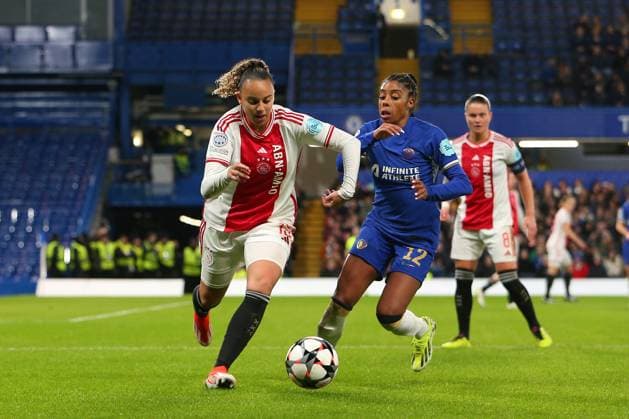 27th March 2024; Stamford Bridge, London, England: UEFA Womens Champions League Football, Chelsea versus Ajax; Chasity Grant of Ajax beats Ashley Lawrence of Chelsea as they compete for the ball.  ActionPlus12622363 KatiexChan