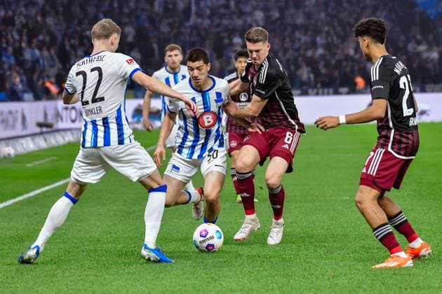 30.03.2024, xlakx, Fussball 2. Bundesliga, Hertha BSC - 1.FC Nuernberg emspor, v.l. Marten Winkler (Hertha BSC 22),Ibrahim Maza (Hertha BSC 30),Florian Flick (1.FC Nuenberg 6),Zweikampf, Duell, Kampf, tackle (DFL DFB REGULATIONS PROHIBIT ANY USE OF PHOTOGRAPHS as IMAGE SEQUENCES and or QUASI-VIDEO) Berlin