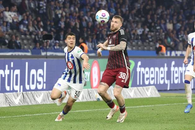 DEU, DFL, 2. FBL, Hertha BSC vs. 1.FC Nuernberg, 30.03.2024, Berliner Olympiastadion, Berlin, DEU, DFL, 2. FBL, Hertha BSC vs. 1.FC Nuernberg, im Bild Ibrahim Maza (Hertha BSC Berlin 30), Jannes Horn (1.FC Nuernberg 38) DFL - regulations prohibit any use of Photographs as image sequences and or quasi-video Foto: Juergen Engler nordphoto GmbH