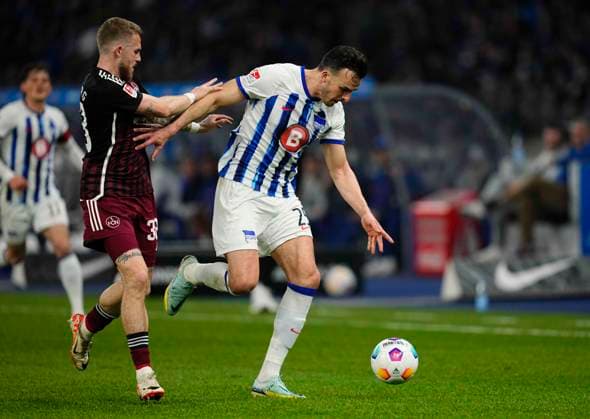Germany, Berlin, 30.03.2024, Olympic Stadium, Hertha BSC vs 1.FC Nürnberg - 2. Bundesliga, Haris Tabakovic (Hertha Berlin) and Jannes Horn (1.FC Nürnberg) battle for the ball Berlin Olympic Stadium Berlin Germany