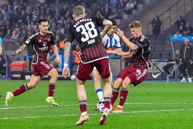 30.03.2024, xlakx, Fussball 2. Bundesliga, Hertha BSC - 1.FC Nuernberg emspor, v.l.Jannes Horn (1.FC Nuenberg 38),Ibrahim Maza (Hertha BSC 30),Finn Jeltsch (1.FC Nuenberg 44),Zweikampf, Duell, Kampf, tackle (DFL DFB REGULATIONS PROHIBIT ANY USE OF PHOTOGRAPHS as IMAGE SEQUENCES and or QUASI-VIDEO) Berlin