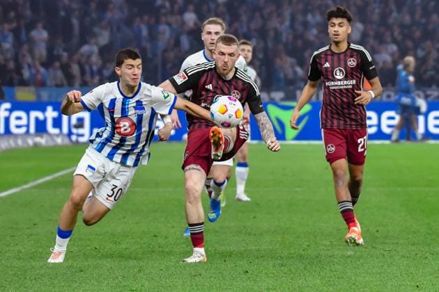 30.03.2024, xlakx, Fussball 2. Bundesliga, Hertha BSC - 1.FC Nuernberg emspor, v.l. Ibrahim Maza (Hertha BSC 30),Jannes Horn (1.FC Nuenberg 38),Nathaniel Brown (1.FC Nuenberg 27),Zweikampf, Duell, Kampf, tackle (DFL DFB REGULATIONS PROHIBIT ANY USE OF PHOTOGRAPHS as IMAGE SEQUENCES and or QUASI-VIDEO) Berlin