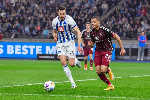 30.03.2024, xlakx, Fussball 2. Bundesliga, Hertha BSC - 1.FC Nuernberg emspor, v.l.Haris Tabakovic (Hertha BSC 25),Jan Gyamerah (1.FC Nuenberg 28),Zweikampf, Duell, Kampf, tackle (DFL DFB REGULATIONS PROHIBIT ANY USE OF PHOTOGRAPHS as IMAGE SEQUENCES and or QUASI-VIDEO) Berlin