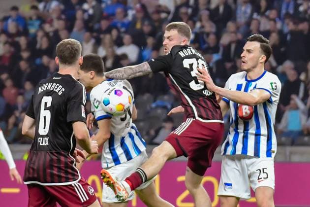 30.03.2024, xlakx, Fussball 2. Bundesliga, Hertha BSC - 1.FC Nuernberg emspor, v.l.Florian Flick (1.FC Nuenberg 6),Jannes Horn (1.FC Nuenberg 38),Haris Tabakovic (Hertha BSC 25),Zweikampf, Duell, Kampf, tackle (DFL DFB REGULATIONS PROHIBIT ANY USE OF PHOTOGRAPHS as IMAGE SEQUENCES and or QUASI-VIDEO) Berlin