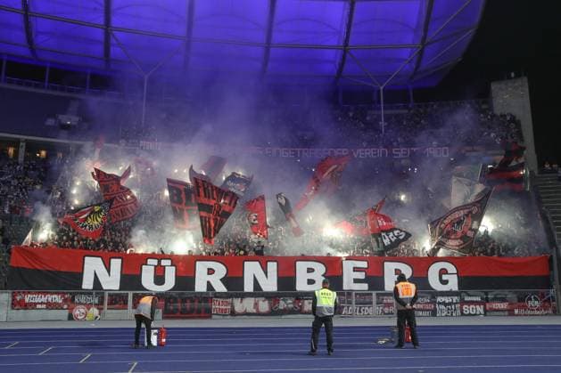 30.03.2024, xtgx, Fussball - 2.Bundesliga, Hertha BSC Berlin - 1.FC Nuernberg emspor, v.l. Symbolfoto, Symbolbild, Fans von Nuernberg zuenden Pyro, Pyrotechnik (DFL DFB REGULATIONS PROHIBIT ANY USE OF PHOTOGRAPHS as IMAGE SEQUENCES and or QUASI-VIDEO) Berlin