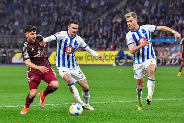 30.03.2024, xlakx, Fussball 2. Bundesliga, Hertha BSC - 1.FC Nuernberg emspor, v.l.Taylan Duman (1.FC Nuenberg 8),Smail Prevljak (Hertha BSC 9),Florian Niederlechner (Hertha BSC 7),Zweikampf, Duell, Kampf, tackle (DFL DFB REGULATIONS PROHIBIT ANY USE OF PHOTOGRAPHS as IMAGE SEQUENCES and or QUASI-VIDEO) Berlin