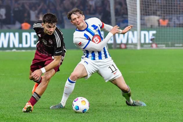 30.03.2024, xlakx, Fussball 2. Bundesliga, Hertha BSC - 1.FC Nuernberg emspor, v.l.Can Yilmaz Uzun (1.FC Nuenberg 42),Fabian Reese (Hertha BSC 11),Zweikampf, Duell, Kampf, tackle (DFL DFB REGULATIONS PROHIBIT ANY USE OF PHOTOGRAPHS as IMAGE SEQUENCES and or QUASI-VIDEO) Berlin