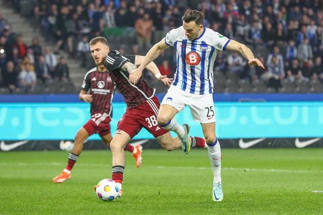 30.03.2024, xtgx, Fussball - 2.Bundesliga, Hertha BSC Berlin - 1.FC Nuernberg emspor, v.l. Jannes Horn (Nuernberg, 38), Haris Tabakovic (Hertha, 25) Zweikampf, Duell, Kampf, tackle (DFL DFB REGULATIONS PROHIBIT ANY USE OF PHOTOGRAPHS as IMAGE SEQUENCES and or QUASI-VIDEO) Berlin