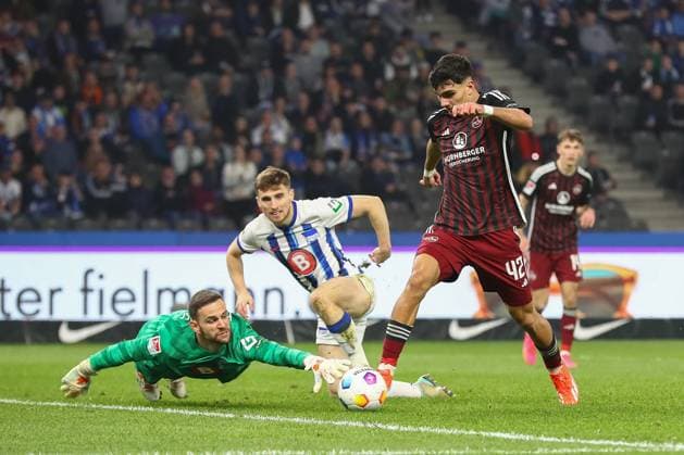 30.03.2024, xtgx, Fussball - 2.Bundesliga, Hertha BSC Berlin - 1.FC Nuernberg emspor, v.l. Can Yilmaz Uzun (Nuernberg, 42) Torschuss, schiesst den Ball aufs Tor, Schuss (DFL DFB REGULATIONS PROHIBIT ANY USE OF PHOTOGRAPHS as IMAGE SEQUENCES and or QUASI-VIDEO) Berlin