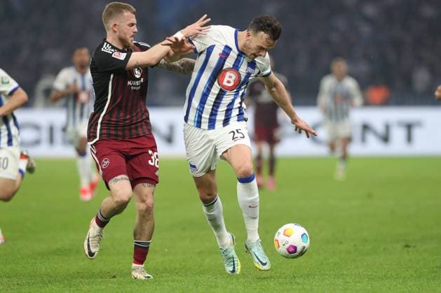 30.03.2024, xtgx, Fussball - 2.Bundesliga, Hertha BSC Berlin - 1.FC Nuernberg emspor, v.l. Jannes Horn (Nuernberg, 38), Haris Tabakovic (Hertha, 25) Zweikampf, Duell, Kampf, tackle (DFL DFB REGULATIONS PROHIBIT ANY USE OF PHOTOGRAPHS as IMAGE SEQUENCES and or QUASI-VIDEO) Berlin