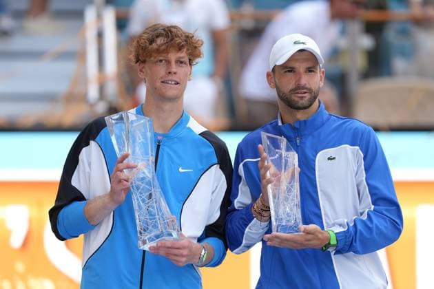 MIAMI GARDENS, FL - MARCH 31: Jannik Sinner (ITA) poses with Grigor Dimitrov (BUL) after winning the menÕs singles final of the Miami Open on March, 31, 2024, at Hard Rock Stadium in Miami Gardens, FL. (Photo by Andrew Patron Icon Sportswire) TENNIS: MAR 31 Miami Open EDITORIAL USE ONLY Icon2403310967