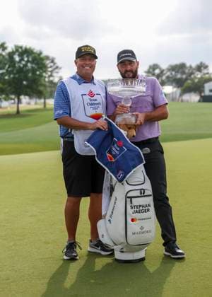 HOUSTON, TX - MARCH 31: (left to right) Caddie Henry Diana and Stephan Jaeger (GER) pose with trophy during the final round of the PGA, Golf Herren Texas Children™s Houston Open at Memorial Park Golf Course on March 31, 2024 in Houston, Texas. (Photo by Leslie Plaza Johnson Icon Sportswire) GOLF: MAR 31 PGA Texas Children s Houston Open EDITORIAL USE ONLY Icon240331138