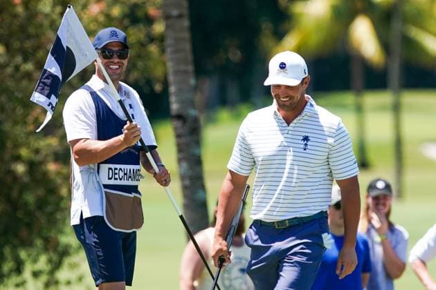 April 6, 2024, Doral, Florida, USA: Bryson DeChambeau (R) of the Crushers shares a laugh with his caddie, Greg Bodine, on the 2nd hole during the second round of LIV Golf Miami at Trump National Doral. Doral USA - ZUMAw109 20240406_fap_w109_003 Copyright: xDebbyxWongx