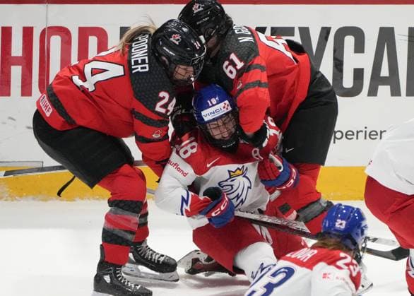 April 7, 2024, Utica, Ny, UNITED STATES: Canada s Natalie Spooner (24) and Nicole Gosling (61) take down Czechia s Michaela Pejzlova (18) during first period hockey action at the IIHF Women s World Hockey Championship in Utica, N.Y., Sunday, April 7, 2024. Canada News - April 7, 2024  - ZUMAc35_ 20240407_zaf_c35_027 Copyright: xChristinnexMuschix