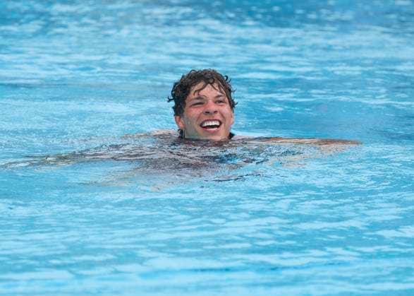 HOUSTON, TX - APRIL 07: Ben Shelton (USA) takes a swim in the pool after jumping in, as is the custom for the championship winners, during the singles final match of the US Clay Court Championships on April 7, 2024 at River Oaks Country Club in Houston, Texas. (Photo by Leslie Plaza Johnson Icon Sportswire) TENNIS: APR 07 US Clay Court Championships EDITORIAL USE ONLY Icon240407047