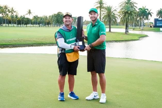 April 7, 2024, Doral, Florida, USA: Dean Burmester (R) and his caddie Jason Reynolds of Stinger pose with the trophy after winning the individual event after the final round of LIV Golf Miami at Trump National Doral. Doral USA - ZUMAw109 20240407_fap_w109_021 Copyright: xDebbyxWongx