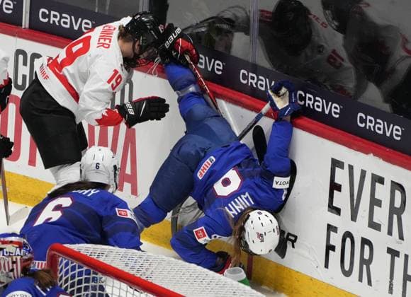 April 8, 2024, Utica, Ny, UNITED STATES: United States Haley Winn (8) is upended behind the net by Canada s Brianne Jenner (19) during first period hockey action at the IIHF Women s World Hockey Championship in Utica, N.Y., Monday, April 8, 2024. Canada News - April 8, 2024  - ZUMAc35_ 20240408_zaf_c35_248 Copyright: xChristinnexMuschix