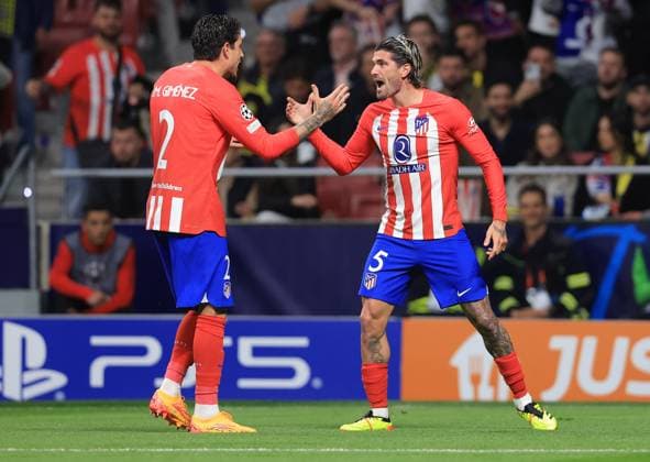 Madrid, Spain, 10th April 2024. Rodrigo De Paul (R) of Athletico Madrid celebrates with Jose Gimenez after scoring the opening goal during the UEFA Champions League match at Wanda Metropolitano, Madrid. Picture credit should read: Paul Terry Sportimage EDITORIAL USE ONLY. No use with unauthorised audio, video, data, fixture lists, club league logos or live services. Online in-match use limited to 120 images, no video emulation. No use in betting, games or single club league player publications. SPI-3067-0018