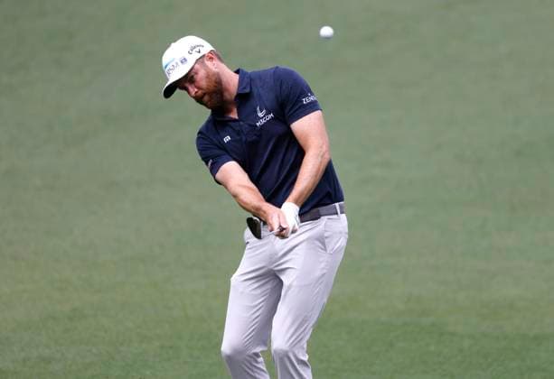 Chris Kirk chips to the green on the second hole during the first round of the Masters Tournament at Augusta National Golf Club in Augusta, Georgia on Thursday, April 11, 2024.  AUG20240411521 TANNENxMAURY