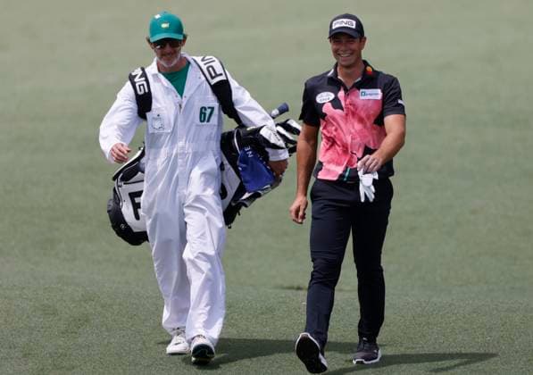 Sweden s Viktor Hovland walks to the green with his caddie Shay Knight on the second hole during the first round of the Masters Tournament at Augusta National Golf Club in Augusta, Georgia on Thursday, April 11, 2024.  AUG20240411553 TANNENxMAURY