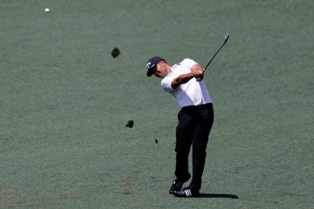 Xander Schauffele hits an approach shot on the second hole during the first round of the Masters Tournament at Augusta National Golf Club in Augusta, Georgia on Thursday, April 11, 2024.  AUG20240411566 TANNENxMAURY