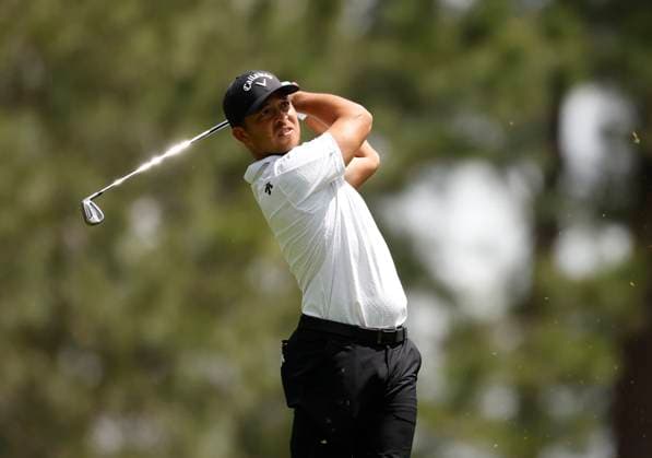 Xander Schauffele hits his tee shot on the fourth hole during the first round of the Masters Tournament at Augusta National Golf Club in Augusta, Georgia on Thursday, April 11, 2024.  AUG20240411125 JOHNxANGELILLO
